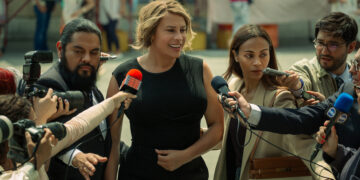 a woman being interviewed by the news