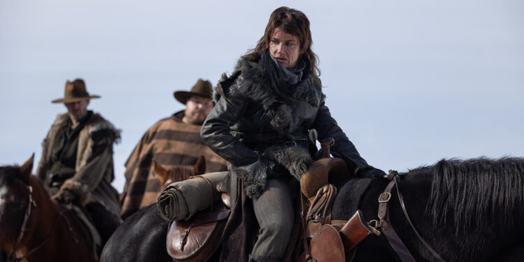 a feral looking woman riding on a horse
