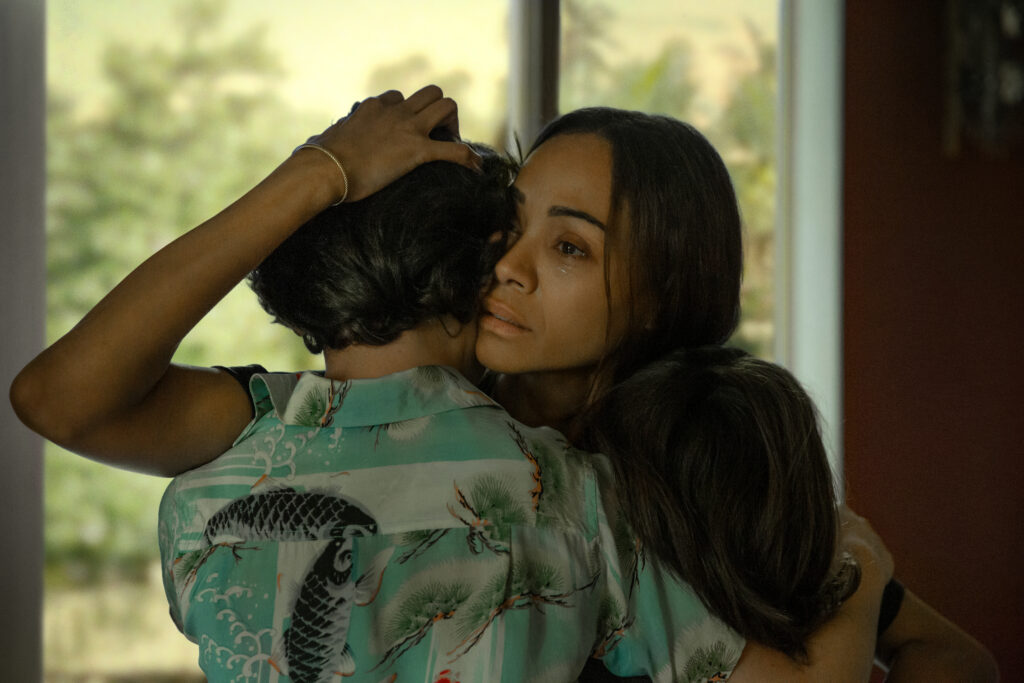 a woman hugs a child