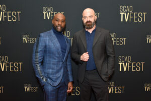 Morris Chestnut and Craig Sweeny posing on the red carpet 