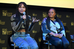 adele supreme williams and Dominique braud speak in front of a crowd at SCAD tvfest