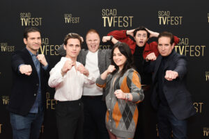 the cast of cobra kai standing on the red carpet for scad tvfest