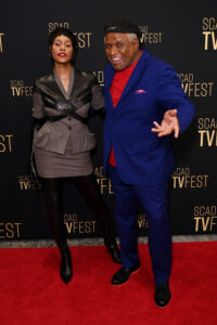 laverne cox and george wallace stand on the scad tvfest red carpet