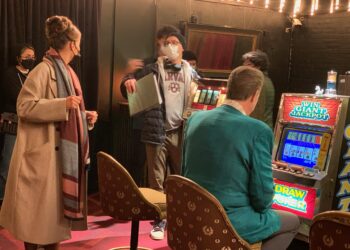 a director on a casino set directing an actor