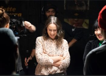a woman in the spotlight on a movie set