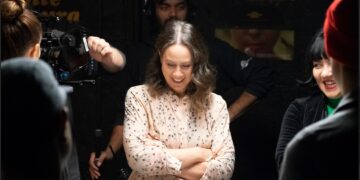 a woman in the spotlight on a movie set