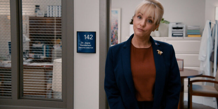st. denis medical joyce stands in the doorway, played by Wendi McLendon-Covey