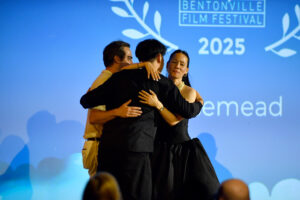 the Rosemead team hug each other after winning the top award at the Bentonville Film Festival