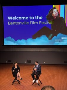 debra birnbaum and ernie bustamante in chairs at the bentonville film festival