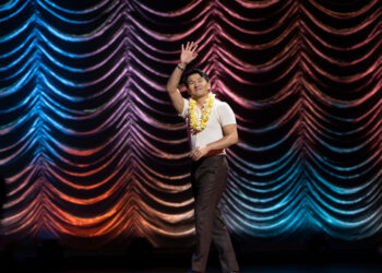 ronny chieng is on stage for his netflix special love to hate it