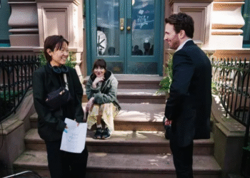 Celine Song with Dakota Johnson and Chris Evans on set of Materialists