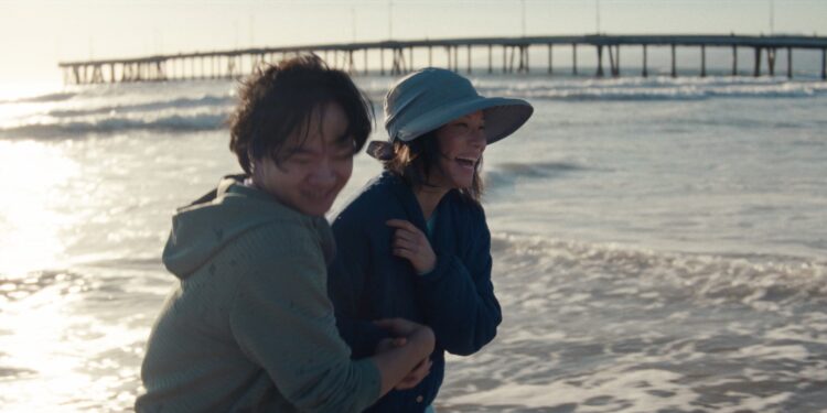 Rosemead movie still with Lucy Liu and Lawrence Shou on the beach