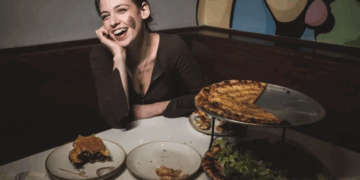 comedian chloe radcliffe at restaurant with pizza