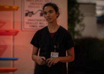 supriya ganesh the pitt's dr. mohan stands outside of the ER