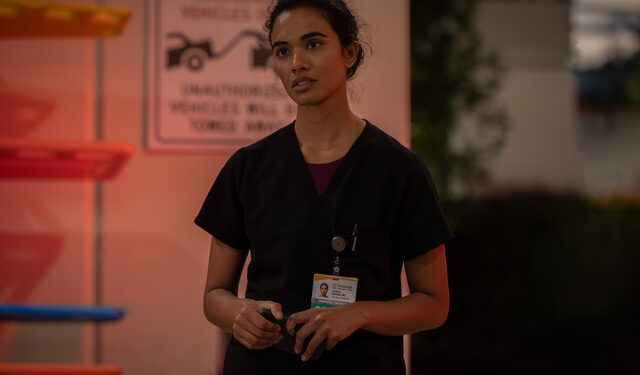 supriya ganesh the pitt's dr. mohan stands outside of the ER