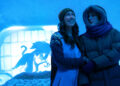 two characters stand in an ice hotel on pluribus