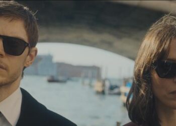 the beauty rebecca hall character jordan stands next to evan peters' cooper