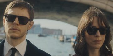 the beauty rebecca hall character jordan stands next to evan peters' cooper