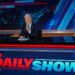 jon stewart at the desk of the daily show