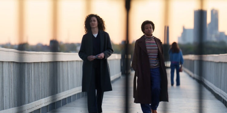 emmy rossum and quincy tyler bernstine walking on a bridge in furious on hulu