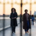 emmy rossum and quincy tyler bernstine walking on a bridge in furious on hulu