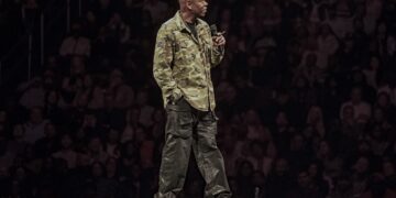 dave chappelle on stage in a colin kaepernick jacket