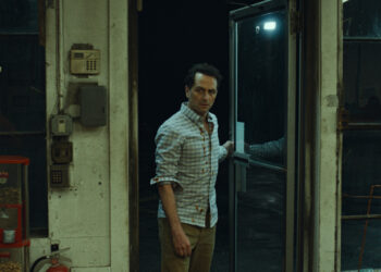 matthew rhys as tom loftis enters a convenience store on widow's bay