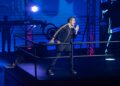 David Harbour in a track suit on stage for DTF St. Louis