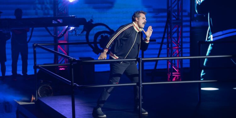 David Harbour in a track suit on stage for DTF St. Louis