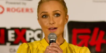 hayden panettierre speaks with a microphone
